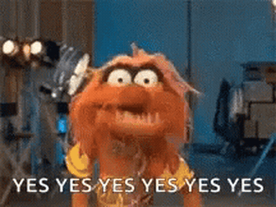 A Puppet Is Standing In Front Of A Sign That Says Yes Yes Yes Yes Yes . GIF