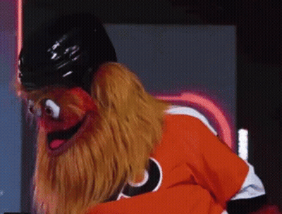 A Puppet Is Wearing A Hockey Helmet And A Flyers Jersey GIF