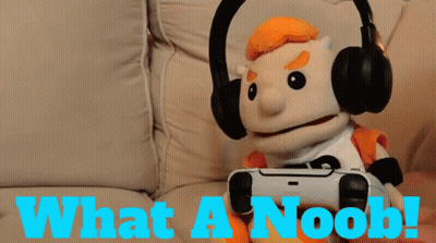 A Puppet Is Wearing Headphones And Holding A Video Game Controller With The Words What A Noob Below Him GIF