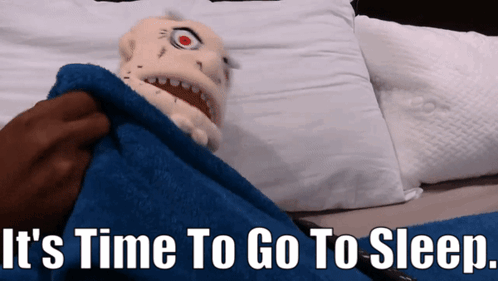 A Puppet Is Wrapped In A Blue Blanket With The Words " It 'S Time To Go To Sleep " Below It GIF