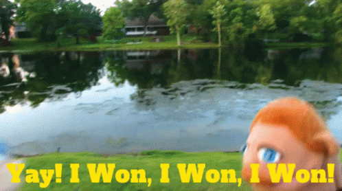 A Puppet Stands In Front Of A Lake With The Words Yay I Won I Won I Won GIF