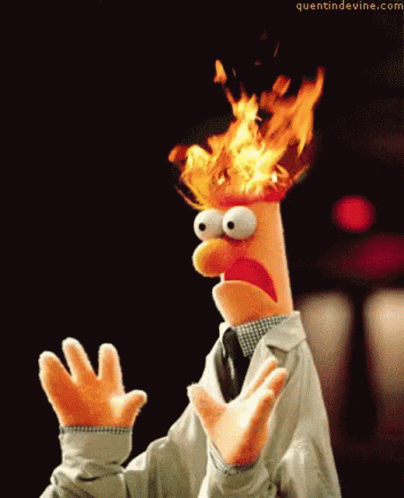 A Puppet With Flames Coming Out Of His Head And The Website Quantindevine.com GIF