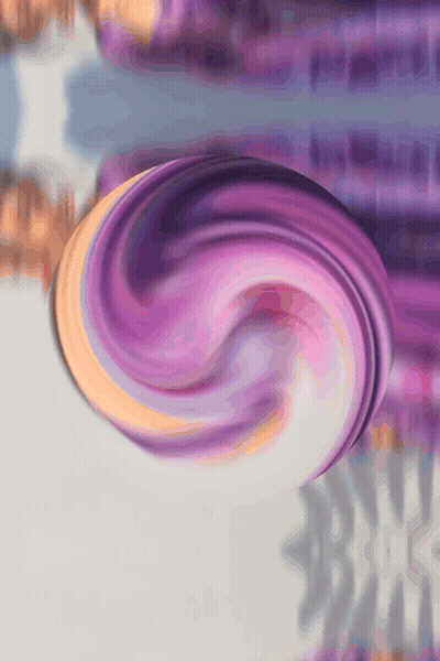 A Purple And Orange Swirl On A Gray Surface GIF