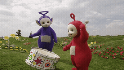 A Purple And Red Teletubbies Are Playing A Drum GIF