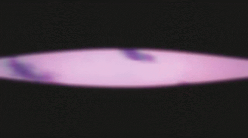 A Purple Background With Clouds In The Sky GIF