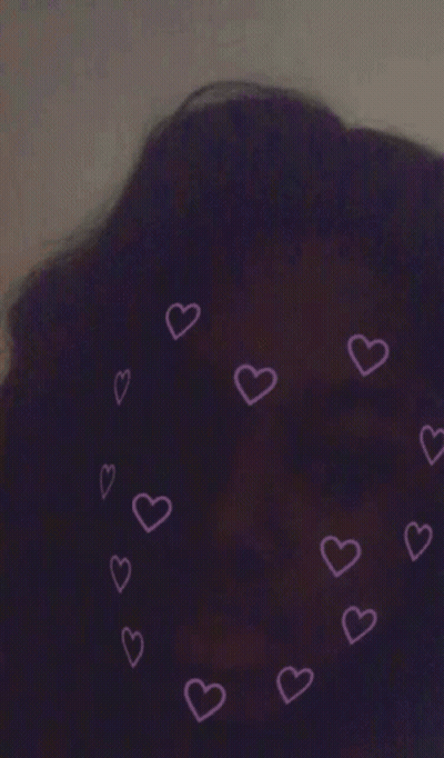 A Purple Background With Pink Hearts Around A Person 'S Head GIF