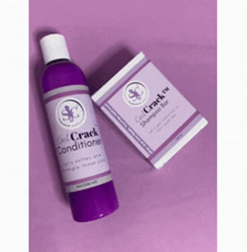 A Purple Bottle Of Conditioner And A Purple Box Of Shampoo Are Sitting On A Purple Surface . GIF