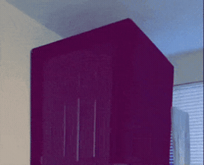 A Purple Box With A Blue Light On The Top Of It GIF