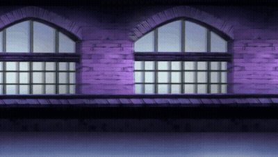 A Purple Brick Building With Arched Windows And A Balcony GIF