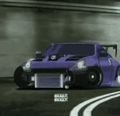 A Purple Car Is Driving Down A Curvy Road . GIF