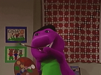 a purple cartoon character holding a palette and a rainbow