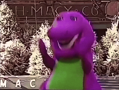 A Purple Dinosaur Is Waving In Front Of A Macy 'S Store GIF