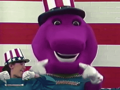 A Purple Dinosaur Is Wearing An Uncle Sam Hat And Giving A Thumbs Up While Standing Next To A Woman . GIF