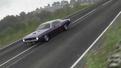 A Purple Dodge Challenger Is Driving Down The Road GIF