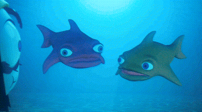 A Purple Fish And A Green Fish Are Swimming Together In The Ocean GIF