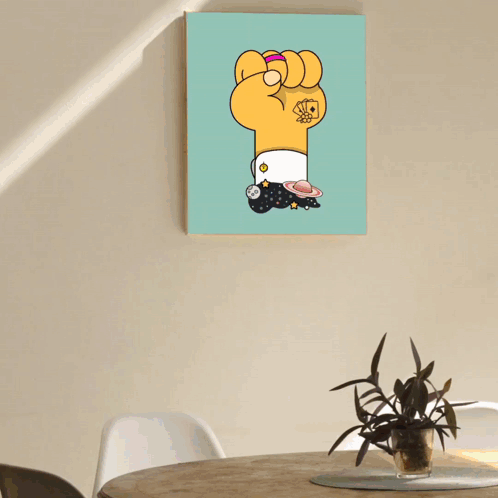 A Purple Fist With A Blue Scarf Around It Hangs On A Wall Next To A Plant GIF