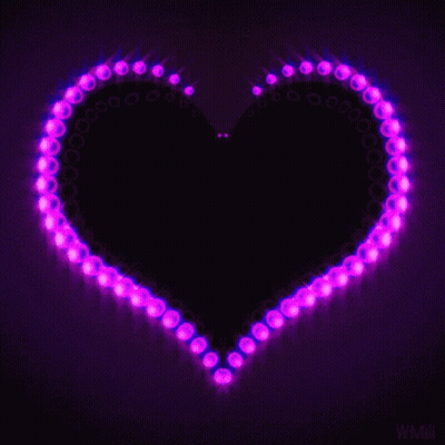 A Purple Heart Is Surrounded By Purple Lights On A Dark Background GIF