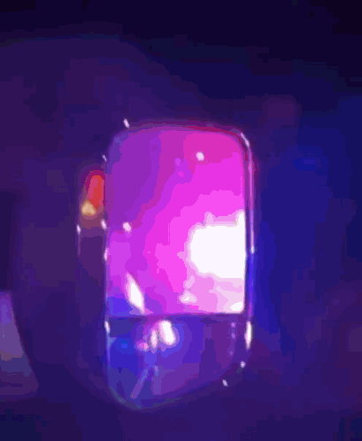 A Purple Light Is Shining On A Person 'S Head GIF