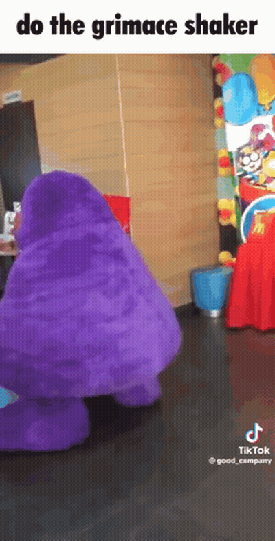 A Purple Mcdonald 'S Mascot Is Dancing In A Room With The Caption Do The Grimace Shaker GIF
