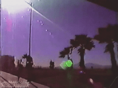 A Purple Sky With Palm Trees In The Foreground And The Words Colouredbills On The Bottom Right GIF
