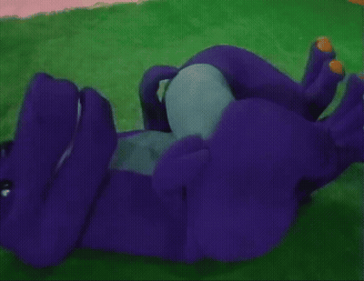 A Purple Stuffed Animal With Yellow Paws Is Laying On Its Back GIF