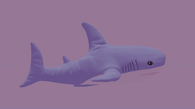 A Purple Stuffed Shark With Its Mouth Open GIF