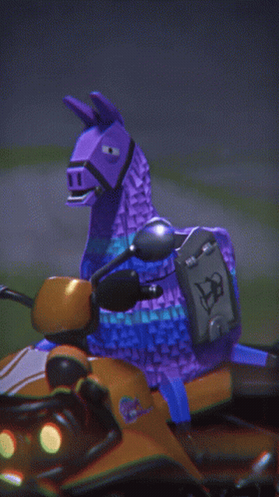 A Purple Toy Llama Is Riding On The Back Of An Orange Vehicle GIF