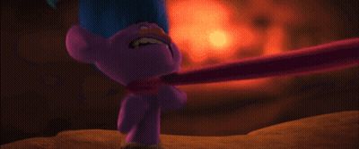 A Purple Troll With Blue Hair Is Holding A Pink Stick To His Neck . GIF