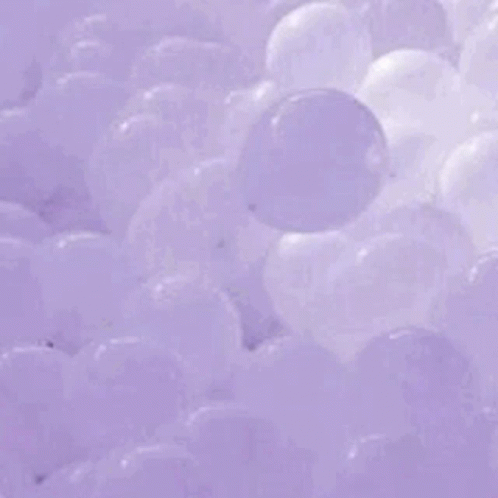A Purple Wave In The Ocean Is Breaking On The Shore . GIF