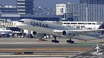 A Qatar Airlines Plane Is On The Runway GIF