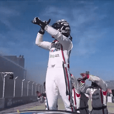 A Race Car Driver Wearing A Uniform That Says Mobil GIF