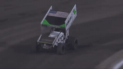 A Race Car Is Crashing Into A Fence And Flying Through The Air . GIF