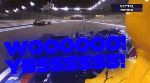 A Race Car Is Driving Down A Race Track And The Words Wooooo Yesssss Are Written In Blue GIF