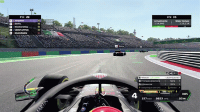 A Race Car Is Driving Down A Track With A Martin Logo On The Side GIF