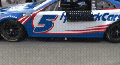 A Race Car That Has The Number 5 On It GIF