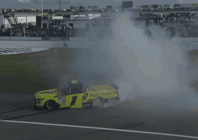 A Race Car With The Number 1 On It Is Smoking GIF