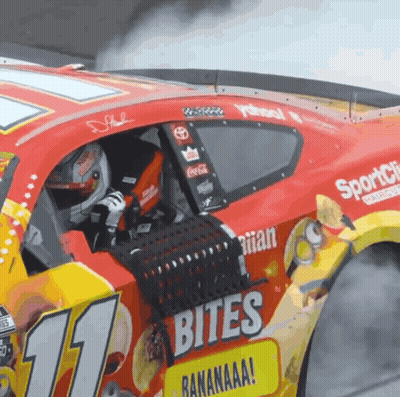 A Race Car With The Number 11 On The Side Of It GIF