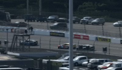 A Race Car With The Number 18 On The Front GIF