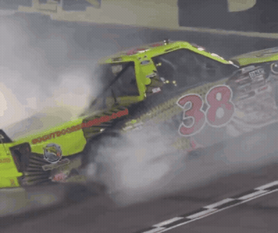 A Race Car With The Number 38 On The Side Of It GIF