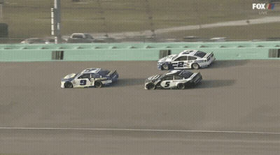 A Race Car With The Number 5 On It GIF