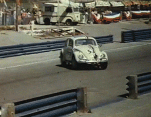 A Race Car With The Number 55 On The Side GIF