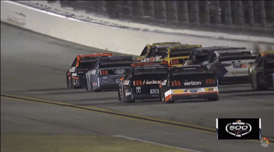 A Race Car With The Word Verizon On The Side GIF