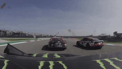 A Race Car With Toyota Written On The Side Of It GIF