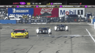 A Race Is Being Shown On Espn With A Banner For Mobil 1 In The Background GIF