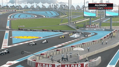 A Race Track With A Sign That Says ' Alonso Lap 1 ' On It GIF
