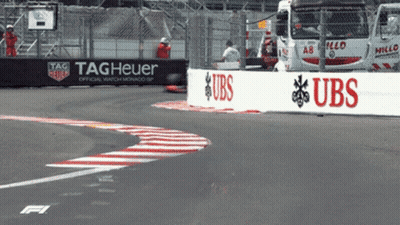 A Race Track With A Sign That Says Tag Heuer On It GIF