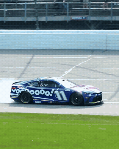 A Racing Car With The Number 11 On It GIF