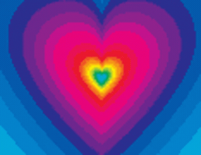 A Rainbow Colored Heart With A Pink Heart In The Middle GIF