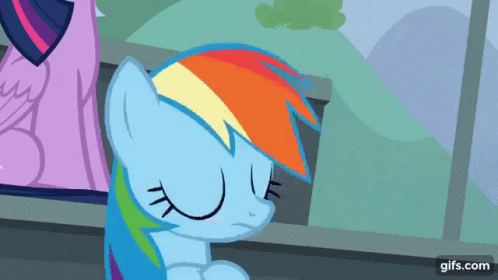 A Rainbow Dash From My Little Pony Is Sitting Down With His Eyes Closed GIF