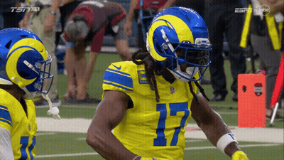 A Rams Football Player Wearing Number 17 Stands On The Field GIF